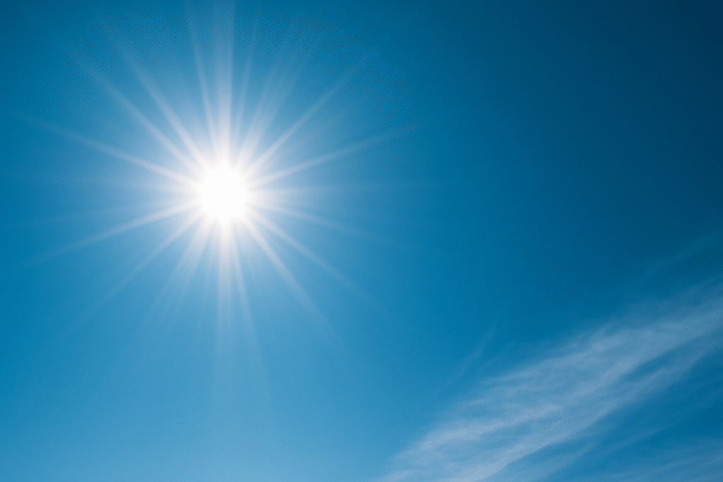 Le soleil brille intensément dans un ciel bleu, symbolisant la lumière intérieure et la confiance retrouvée.